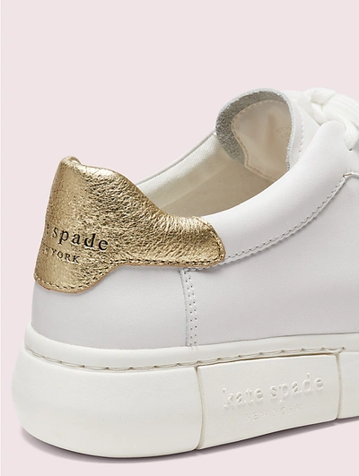 Shop Kate Spade Lift Sneakers In Optic White/pale Gold