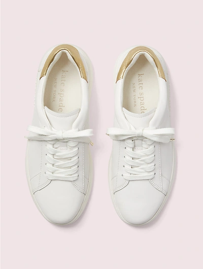Shop Kate Spade Lift Sneakers In Optic White/pale Gold