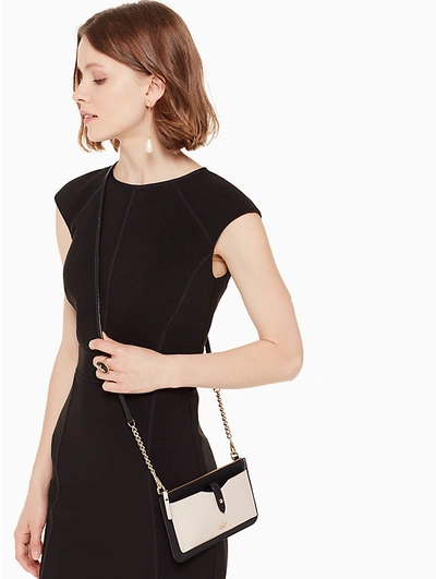 Shop Kate Spade Iphone Crossbody Bag In Tusk/black