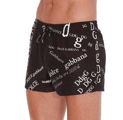 Shop Dolce & Gabbana Allover Logo Swim Shorts In Black
