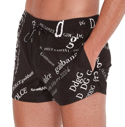 Shop Dolce & Gabbana Allover Logo Swim Shorts In Black