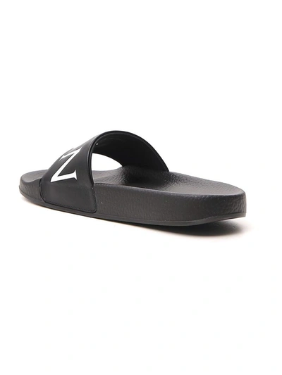 Shop Moncler Logo Slippers In Black