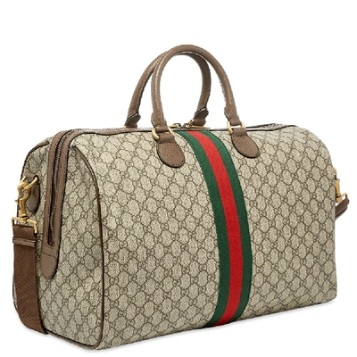 Shop Gucci Ophidia Gg Duffel Bag In Neutrals