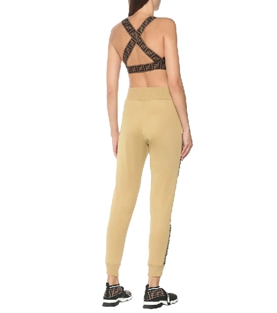 Shop Fendi Logo Cotton-blend Trackpants In Gold