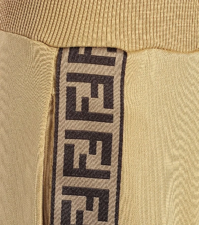 Shop Fendi Logo Cotton-blend Trackpants In Gold