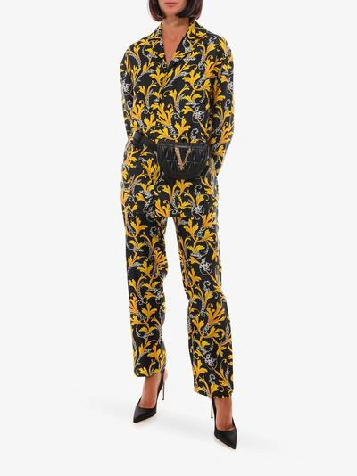 Shop Versace Trousers In Yellow
