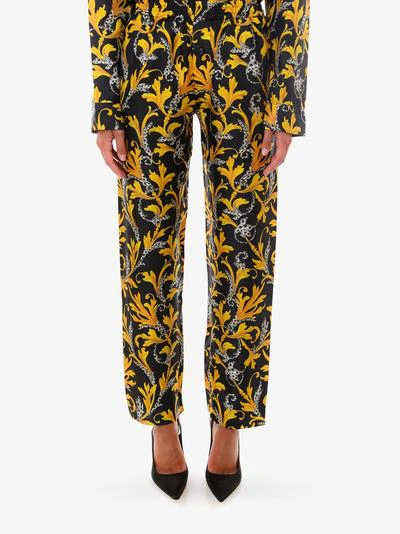 Shop Versace Trousers In Yellow