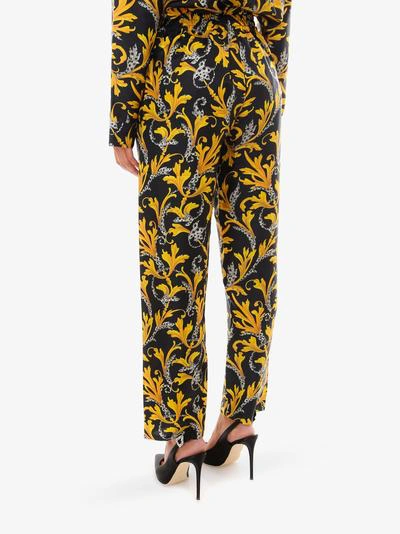 Shop Versace Trousers In Yellow