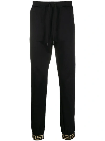 Shop Versace Greca Detail Track Pants In Black