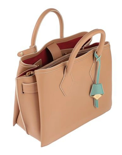 Shop Mcm Handbag In Beige