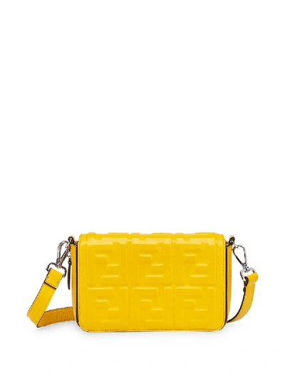 Shop Fendi Embossed Ff Motif Shoulder Bag In Yellow