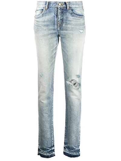 Shop Saint Laurent Ripped-detail Slim-fit Jeans In Blue