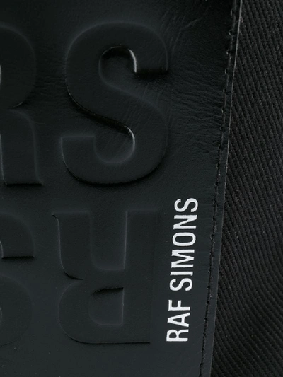 Shop Raf Simons Slogan Print Crossbody Bag In Black