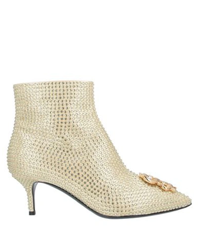 Shop Moschino Ankle Boots In Light Yellow