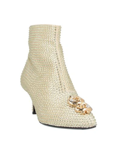 Shop Moschino Ankle Boots In Light Yellow