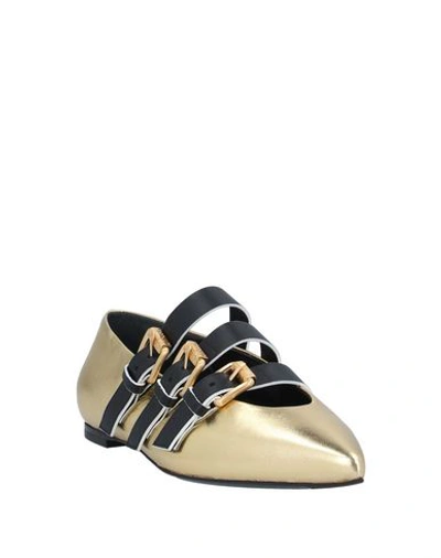 Shop Moschino Ballet Flats In Gold