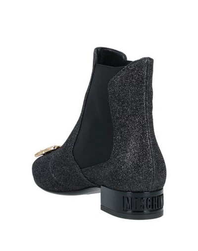 Shop Moschino Ankle Boot In Black