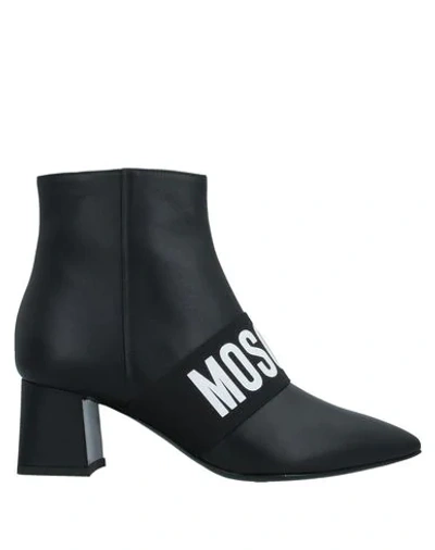 Shop Moschino Ankle Boots In Black