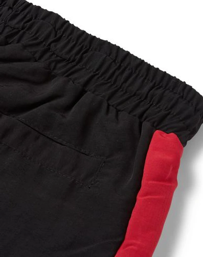 Shop Rhude Pants In Black