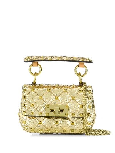 Shop Valentino Micro Rockstud Spike Bag In Gold