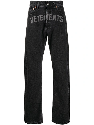 Shop Vetements Logo Print Jeans In Black