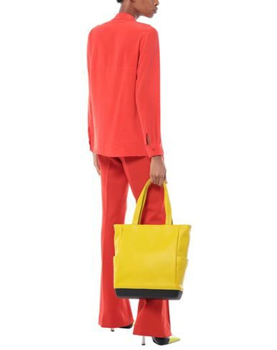Shop Moleskine Handbag In Yellow