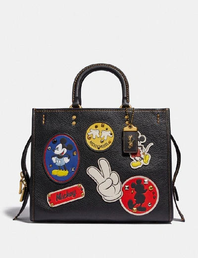 Shop Coach Disney X Rogue With Patches - Women's In Brass/black