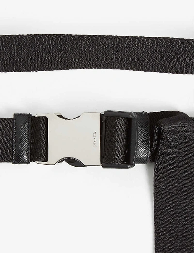 Shop Prada Engraved Buckle Nylon Belt In Black