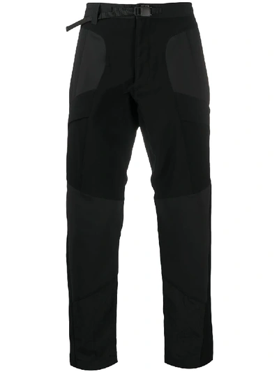 Shop White Mountaineering Slim-fit Panelled Trousers In Black