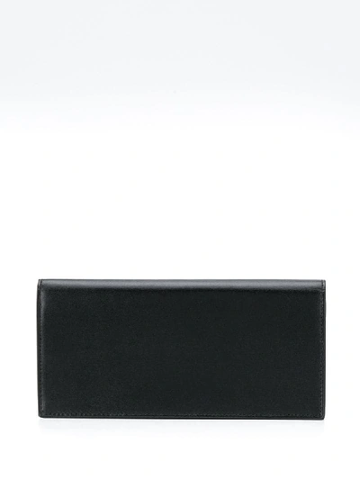 Shop Saint Laurent Monogram Flap Wallet In Black