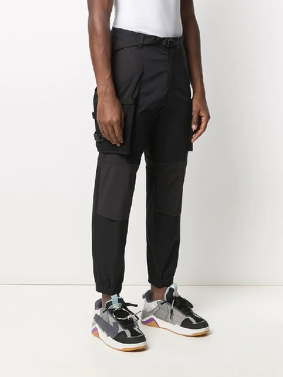 Shop White Mountaineering Panelled Tapered Trousers In Black