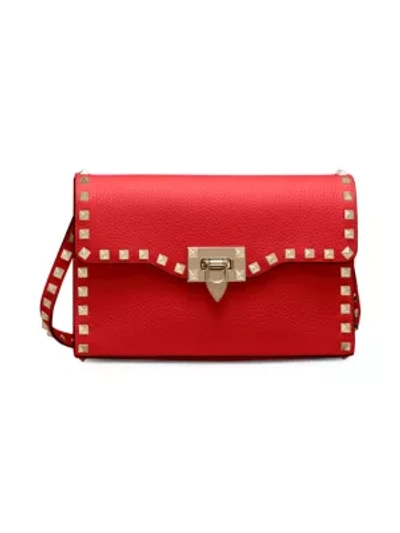 Shop Valentino Women's Small Rockstud Leather Crossbody Bag In Rouge