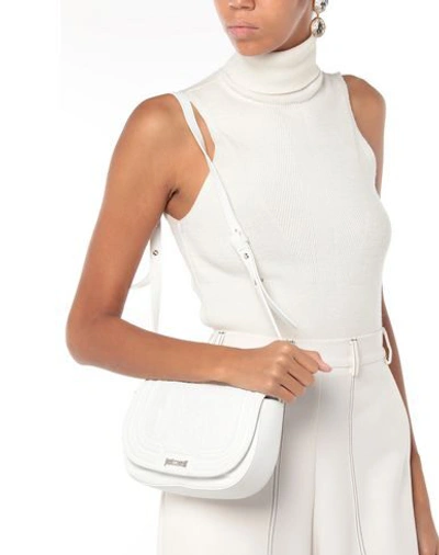 Shop Just Cavalli Cross-body Bags In White