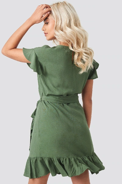 Shop Afj X Na-kd Ruffle Wrap Mini Dress - Green In Khaki