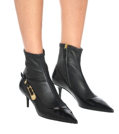 Shop Versace Safety Pin Leather Ankle Boots In Black