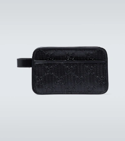 Shop Gucci Gg Embossed Washbag In Black