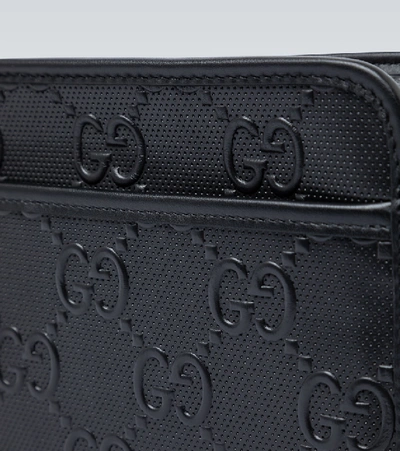 Shop Gucci Gg Embossed Washbag In Black