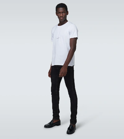 Shop Saint Laurent Skinny-fit Coated Jeans In Black