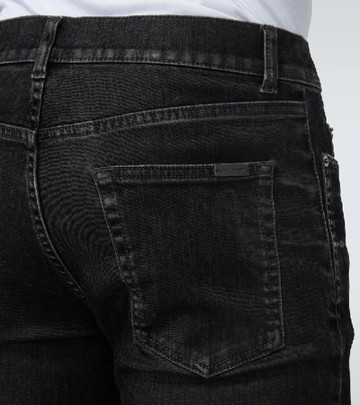 Shop Saint Laurent Skinny-fit Coated Jeans In Black