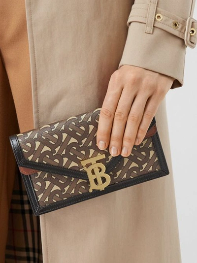 Shop Burberry Belted Monogram E-canvas Tb Envelope Clutch In Bridle Brown