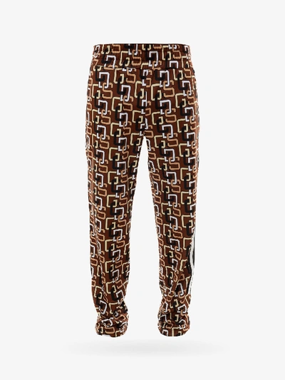 Shop Gcds Trousers In Brown