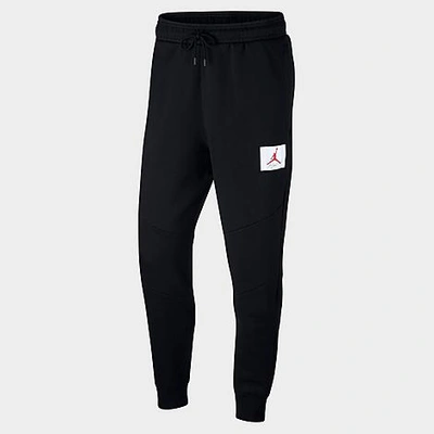 Shop Nike Jordan Men's Flight Tag Fleece Jogger Pants In Black
