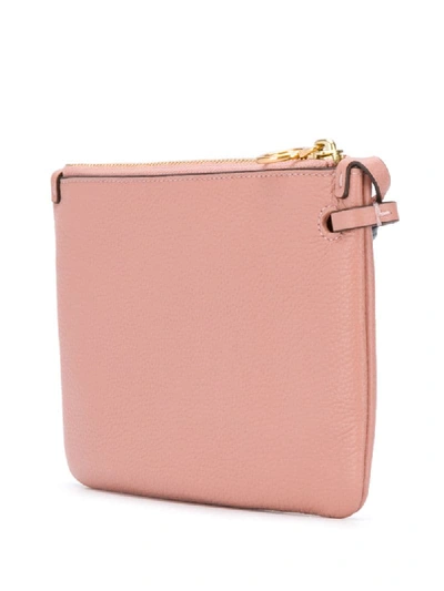 Shop Tory Burch Embossed Logo Clutch In Pink
