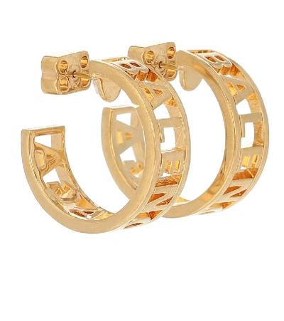 Shop Balenciaga Logo Hoop Earrings In Gold