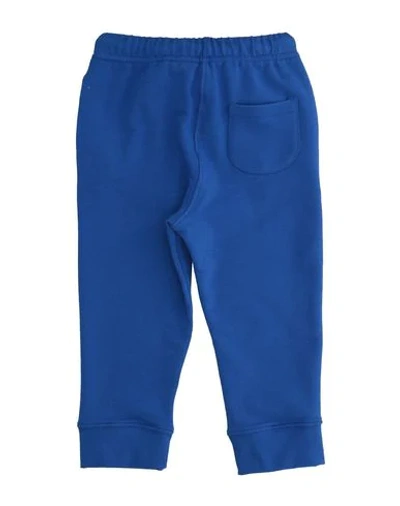 Shop Touriste Casual Pants In Blue