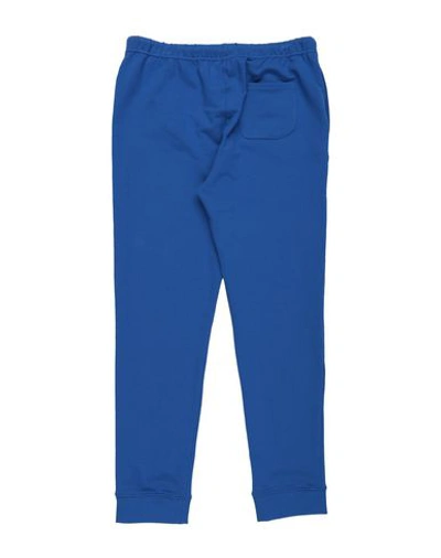Shop Touriste Casual Pants In Blue