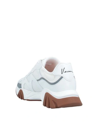 Shop Versace Sneakers In White