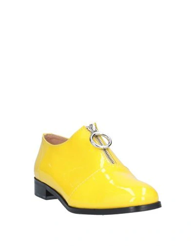 Shop Boutique Moschino Loafers In Yellow