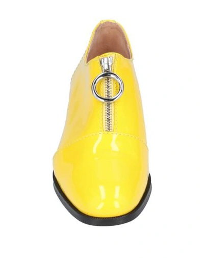 Shop Boutique Moschino Loafers In Yellow