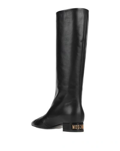 Shop Moschino Knee Boots In Black